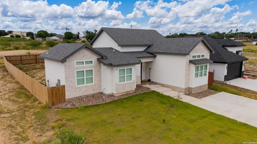 Front exterior of a new home in , Eagle Pass, TX, highlighting curb appeal (Image 1). Front exterior of a new home in , Eagle Pass, TX, highlighting curb appeal (Image 1).