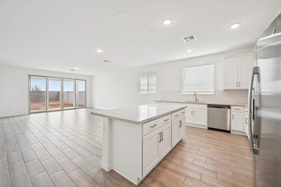 Kitchen and great room. Not actual home, finishes may vary. Kitchen and great room. Not actual home, finishes may vary.