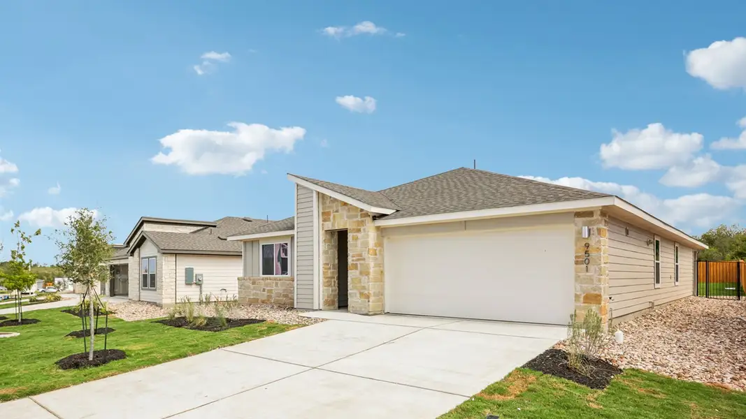 Front exterior of a new home in Trails at Wildhorse, Austin, TX, highlighting curb appeal (Image 19). Front exterior of a new home in Trails at Wildhorse, Austin, TX, highlighting curb appeal (Image 19).