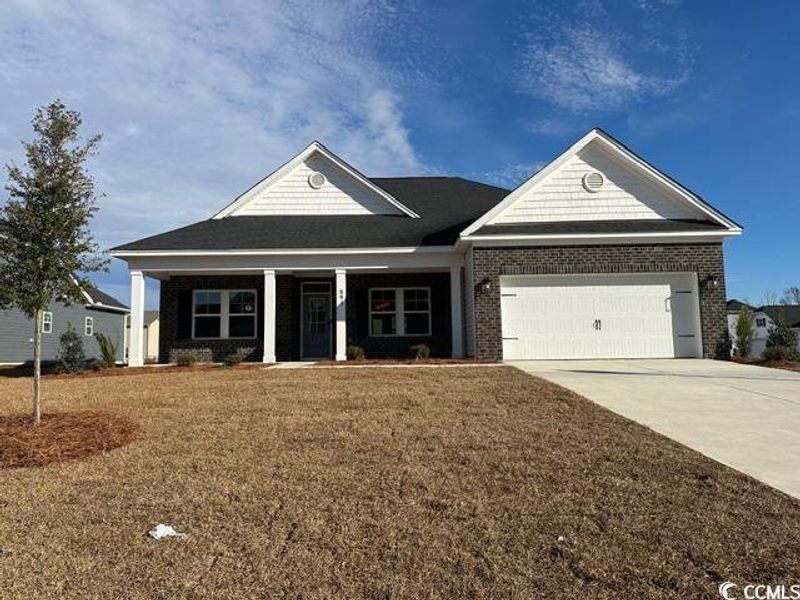 Front exterior of a new home in Oak Hollow, Longs, SC, highlighting curb appeal (Image 1). Front exterior of a new home in Oak Hollow, Longs, SC, highlighting curb appeal (Image 1).