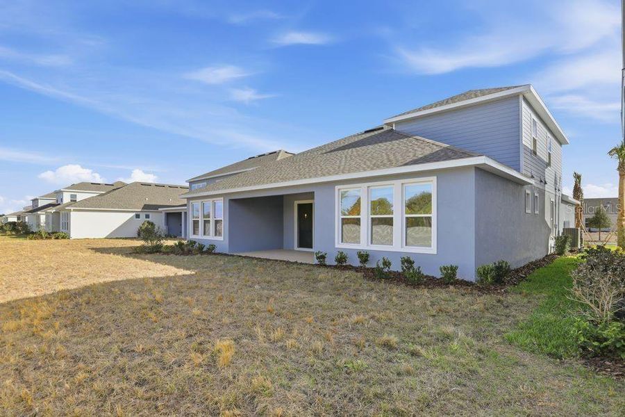 Exterior details and patio area of a home in Center Lake Ranch Community Group Page, St. Cloud (Image 4).