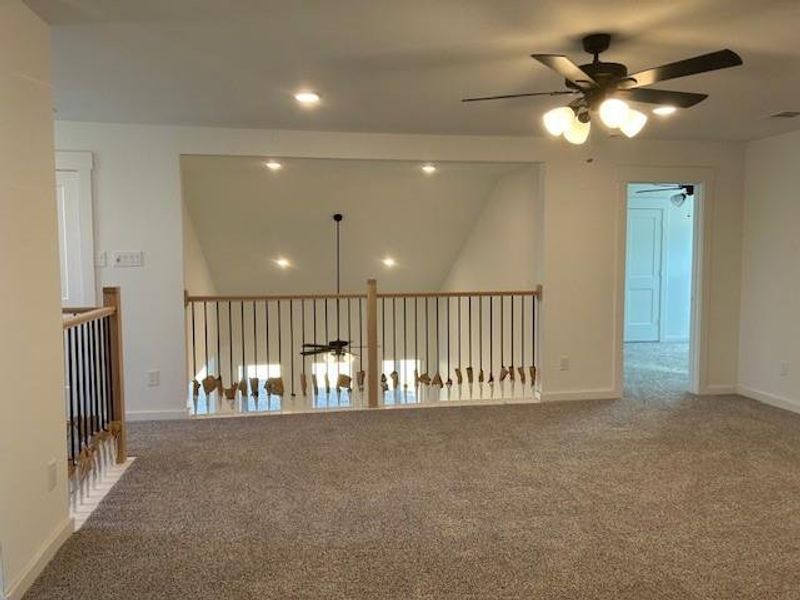 Game room overlooking family room