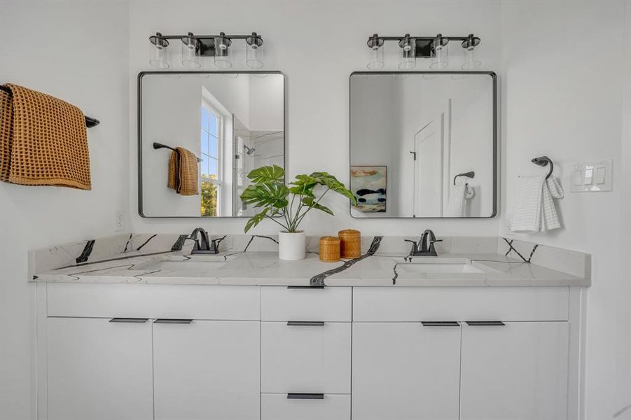 Bathroom featuring walk in shower and vanity