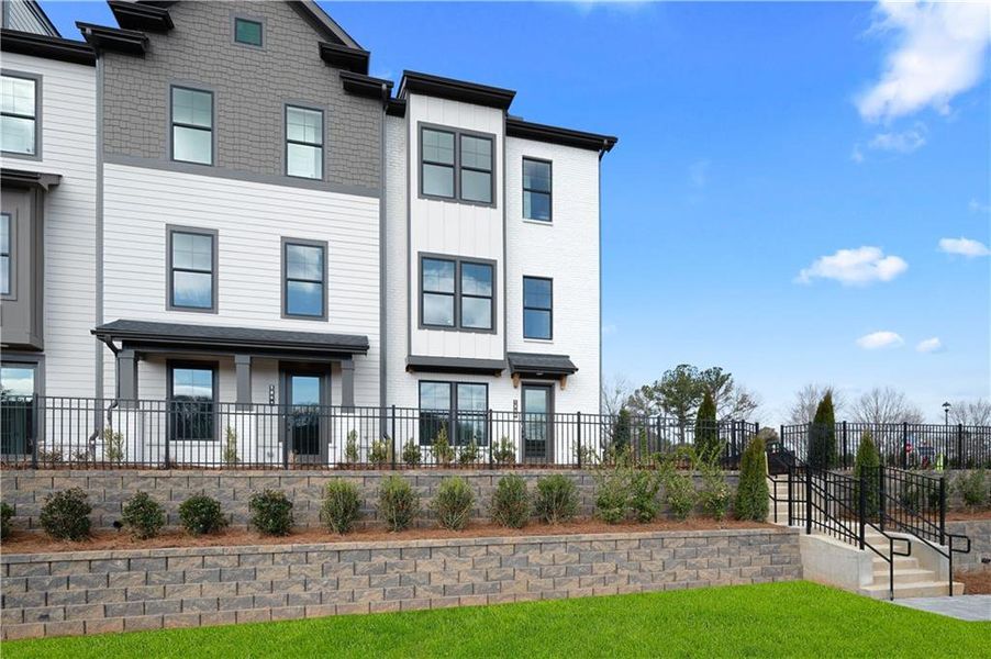 Front exterior of a new home in Barrett Pointe, Kennesaw, GA, highlighting curb appeal (Image 17). Front exterior of a new home in Barrett Pointe, Kennesaw, GA, highlighting curb appeal (Image 17).