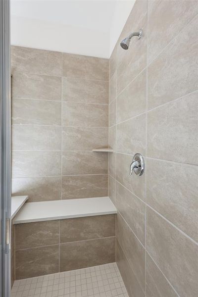 Full bath featuring a shower stall