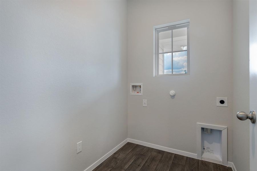 Laundry area with laundry area, hookup for a washing machine, hookup for a gas dryer, hookup for an electric dryer, and dark wood-style flooring