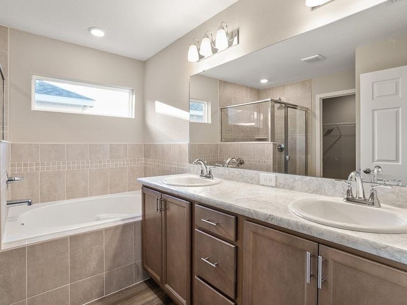 An optional garden tub is available when you build your personalized Begonia - Begonia by Highland Homes