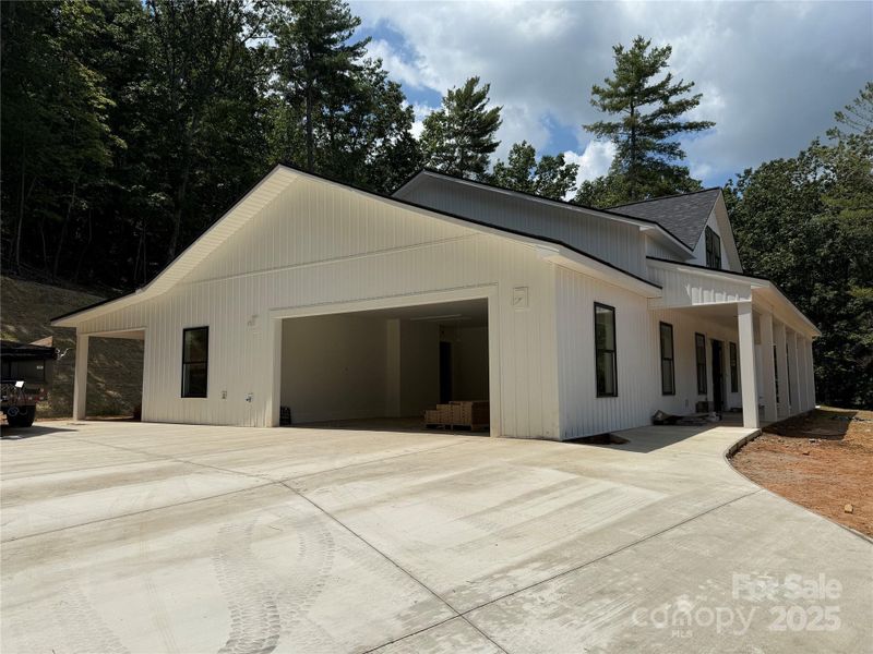 Front exterior of a new home in , Lenoir, NC, highlighting curb appeal (Image 6).