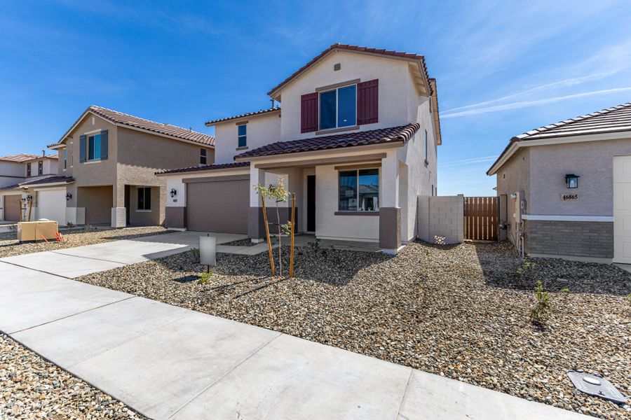Front exterior of a new home in Elara at Moonlight, Maricopa, AZ, highlighting curb appeal (Image 2). Front exterior of a new home in Elara at Moonlight, Maricopa, AZ, highlighting curb appeal (Image 2).