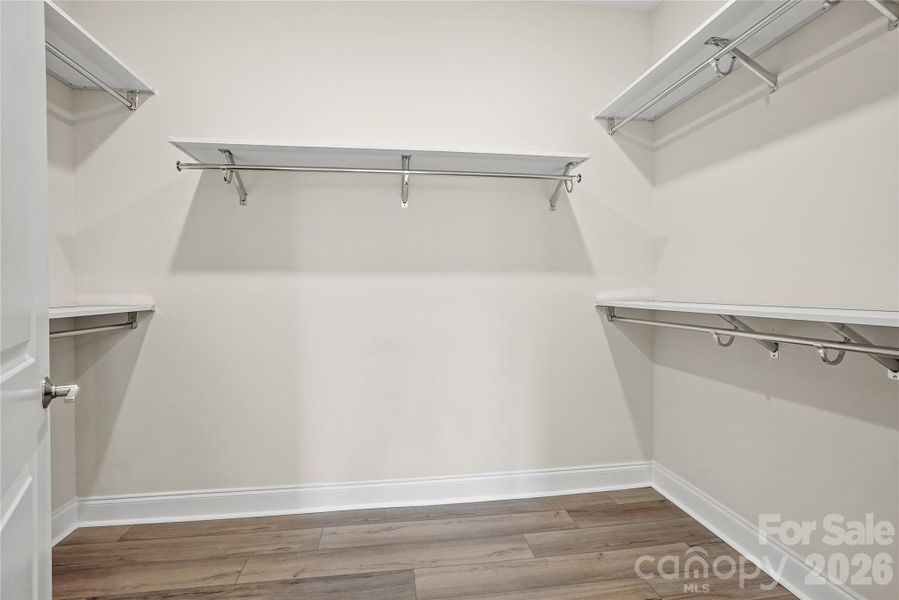 Large primary closet with enhanced shelving