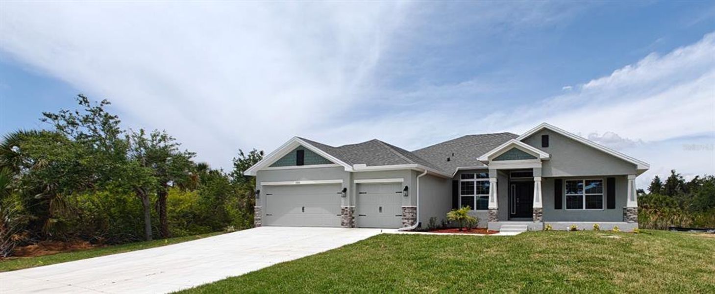 Front exterior of a new home in South Gulf Cove, Port Charlotte, FL, highlighting curb appeal (Image 18).