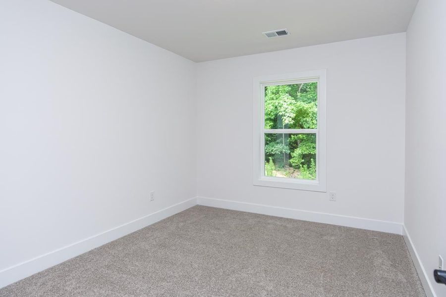 Representative unfurnished interior of a home built from the 1692 Townhome by Adams Homes in Parkstone Place Townhomes, Roebuck (Image 24).