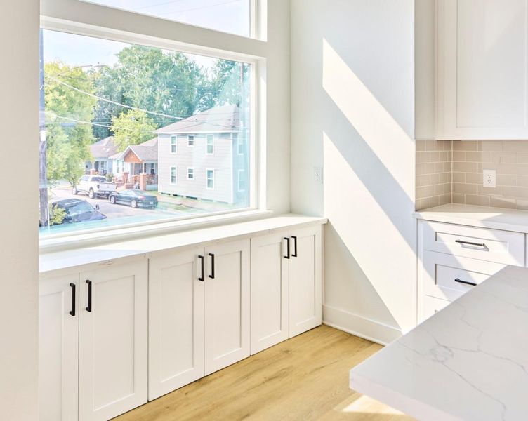 Bright and spacious, this open-concept living, dining, and kitchen area is perfect for entertaining. Featuring pristine quartz countertops, stainless steel appliances, and custom cabinetry, it’s a chef’s dream with plenty of space for hosting guests or enjoying family meals. Bright and spacious, this open-concept living, dining, and kitchen area is perfect for entertaining. Featuring pristine quartz countertops, stainless steel appliances, and custom cabinetry, it’s a chef’s dream with plenty of space for hosting guests or enjoying family meals.