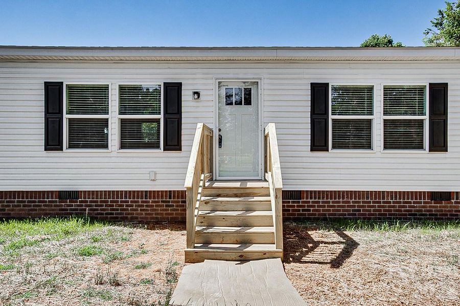 Exterior details and patio area of a home in , Pleasant Garden (Image 26). Exterior details and patio area of a home in , Pleasant Garden (Image 26).
