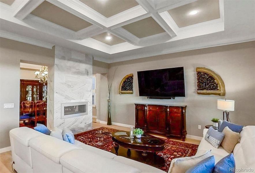 Don't miss the stunning coffered ceiling of the family room and kitchen transition. Such a pretty and elevated architectural detail!