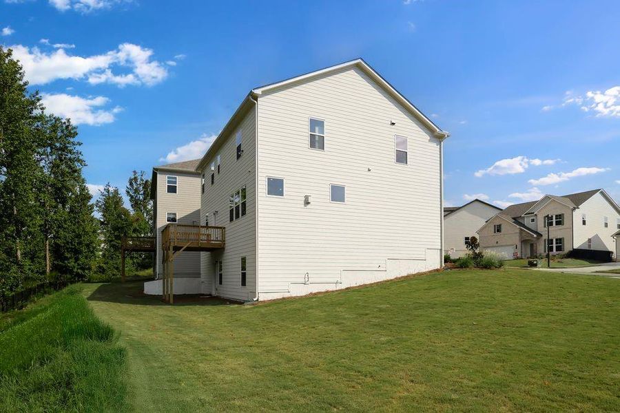 Front exterior of a new home in Falls Creek, Flowery Branch, GA, highlighting curb appeal (Image 22). Front exterior of a new home in Falls Creek, Flowery Branch, GA, highlighting curb appeal (Image 22).
