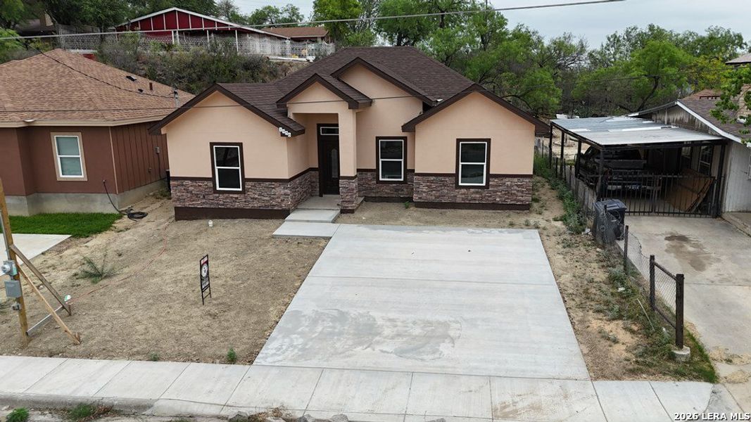 Front exterior of a new home in , Eagle Pass, TX, highlighting curb appeal (Image 19). Front exterior of a new home in , Eagle Pass, TX, highlighting curb appeal (Image 19).