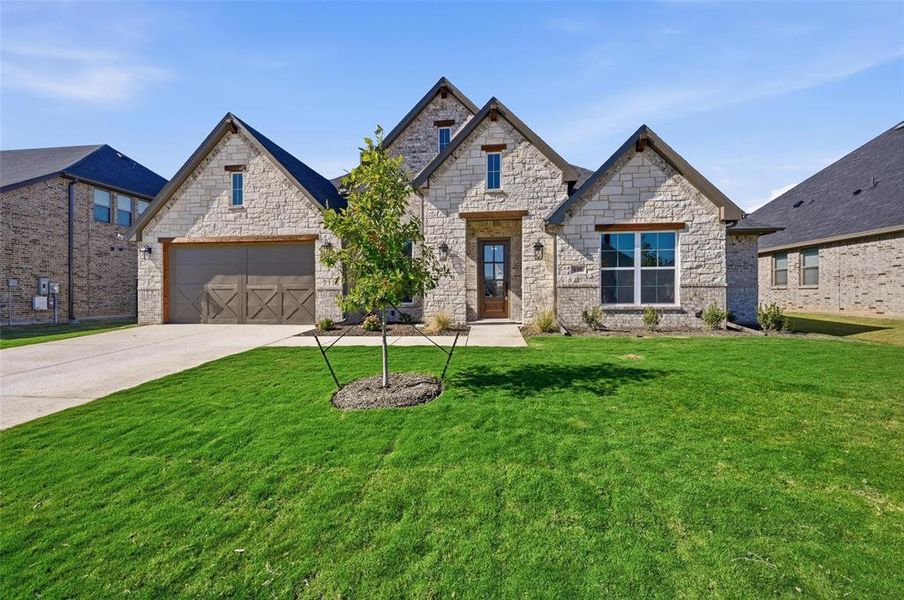 Front exterior of a new home in LeTara, Haslet, TX, highlighting curb appeal (Image 2).