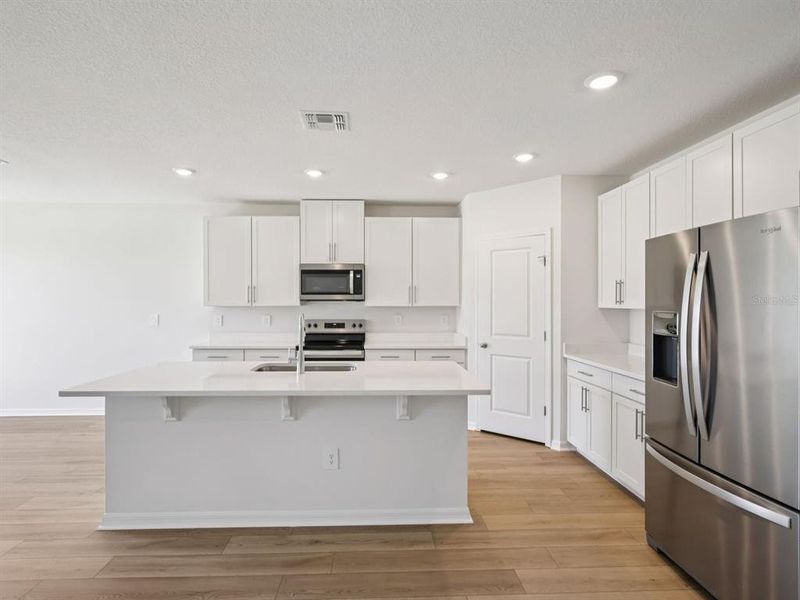 Furnished interior view inside a new home in The Grove at Stuart Crossing - Classic Series, Bartow (Image 10). Furnished interior view inside a new home in The Grove at Stuart Crossing - Classic Series, Bartow (Image 10).