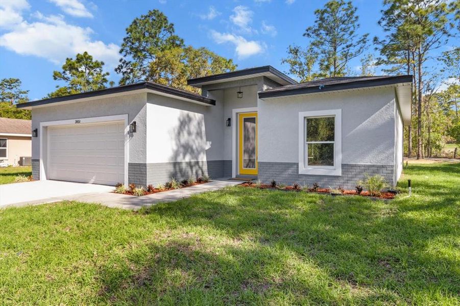 Front exterior of a new home in , Inverness, FL, highlighting curb appeal (Image 1).