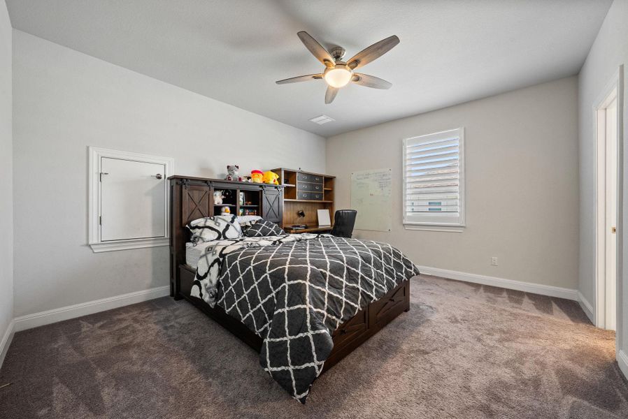 Bedroom featuring carpet flooring and a ceiling fan