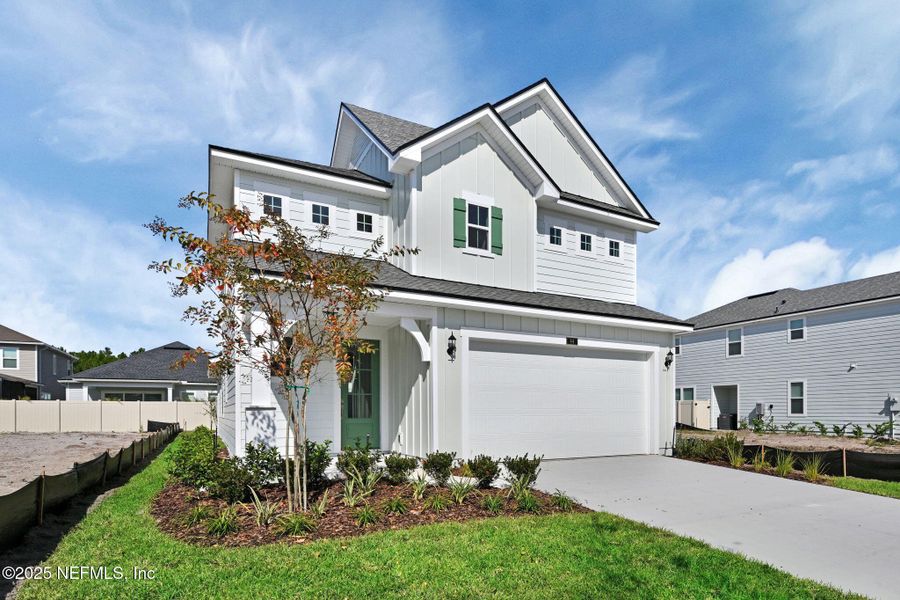 Front exterior of a new home in Seabrook Village at Nocatee, Ponte Vedra, FL, highlighting curb appeal (Image 1).
