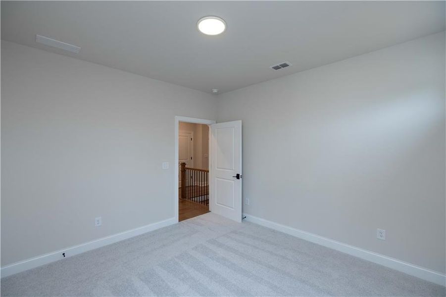 Spacious, unfurnished interior of a new home in Ward's Crossing Townhomes, Johns Creek (Image 16).