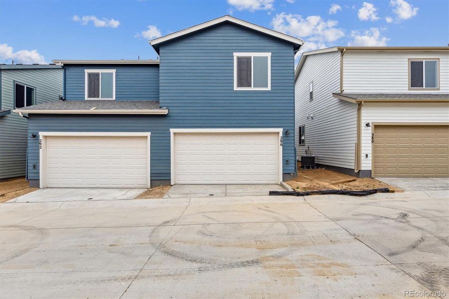 Front exterior of a new home in Pintail Commons at Johnstown Village, Johnstown, CO, highlighting curb appeal (Image 1).