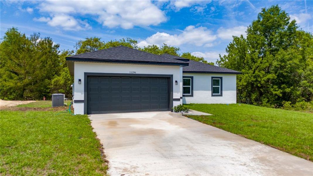 Front exterior of a new home in , Ocala, FL, highlighting curb appeal (Image 2).