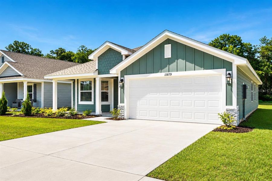 Front exterior of a new home in Kirkland Farms, Alachua, FL, highlighting curb appeal (Image 22).