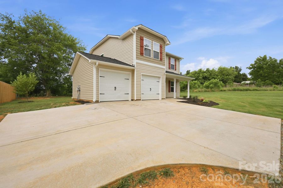 Front exterior of a new home in , Lexington, NC, highlighting curb appeal (Image 25).