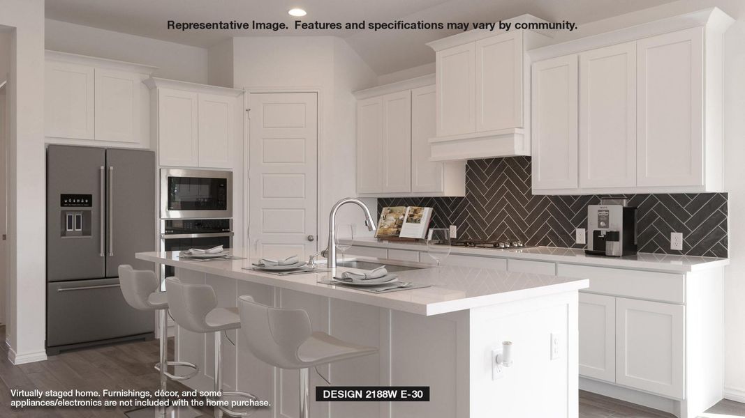 Kitchen with stainless steel appliances, a sink, white cabinets, backsplash, and recessed lighting