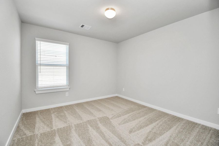 Discover another perspective of the spacious secondary bedrooms! Sample photo of completed home with similar floor plan. Actual colors and selections may vary.
