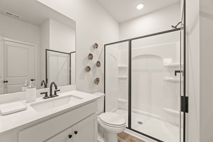 A bathroom with a glass shower.