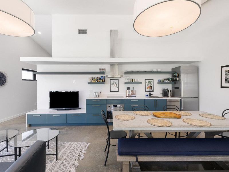 Dining room featuring finished concrete floors