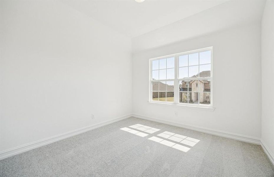 Spacious secondary bedroom with large windows Spacious secondary bedroom with large windows