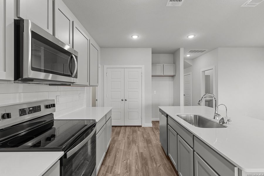 Furnished interior view inside a new home in Hacienda, San Antonio (Image 10).