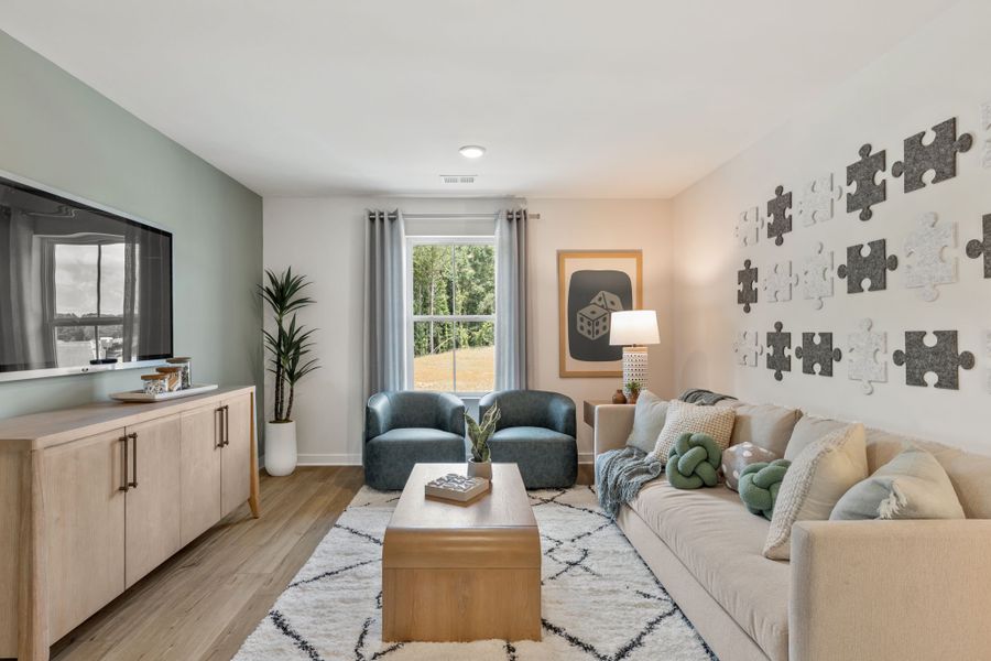 A living room with a couch and a coffee table. A living room with a couch and a coffee table.