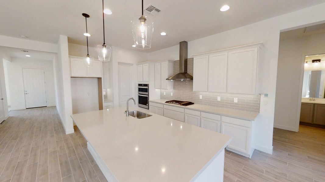 Kitchen & Great Room. Actual finishes may vary by community.