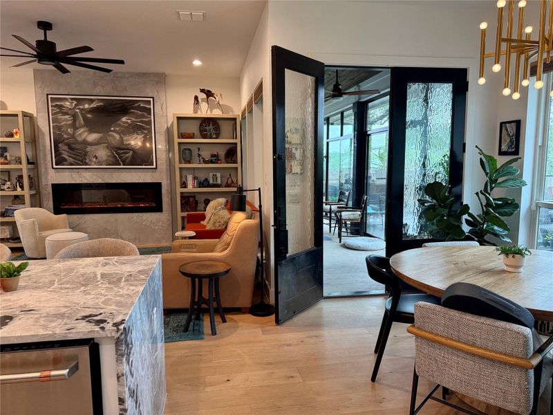 Open-concept living area featuring light wood-finish flooring