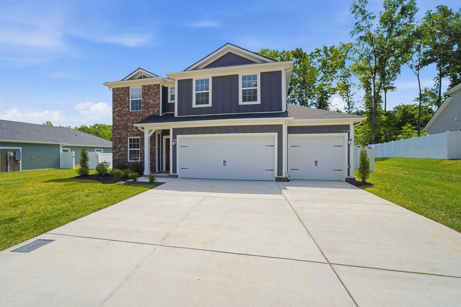 Front exterior of a new home in Brush Creek, Fairview, TN, highlighting curb appeal (Image 26). Front exterior of a new home in Brush Creek, Fairview, TN, highlighting curb appeal (Image 26).