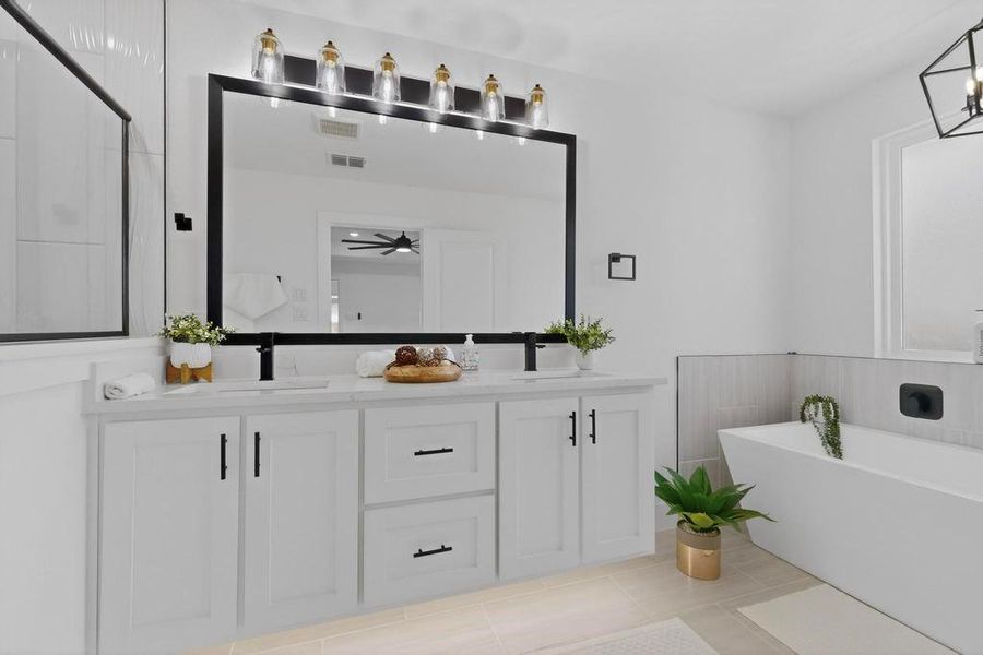 Primary Bathroom with double vanity and a freestanding bath Primary Bathroom with double vanity and a freestanding bath