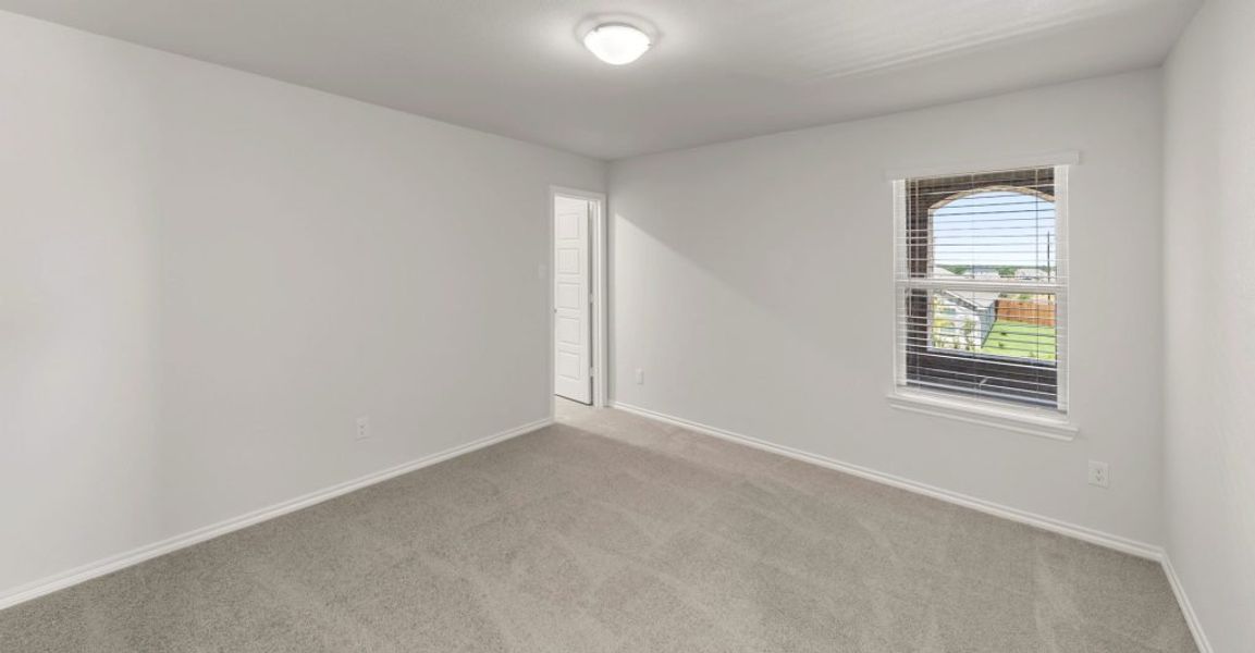 Representative exterior photo of a completed home built from the Raleigh by Impression Homes in Baker Farms, Cleburne, TX (Image 14).