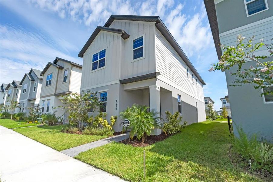 Front exterior of a new home in , St. Cloud, FL, highlighting curb appeal (Image 24).