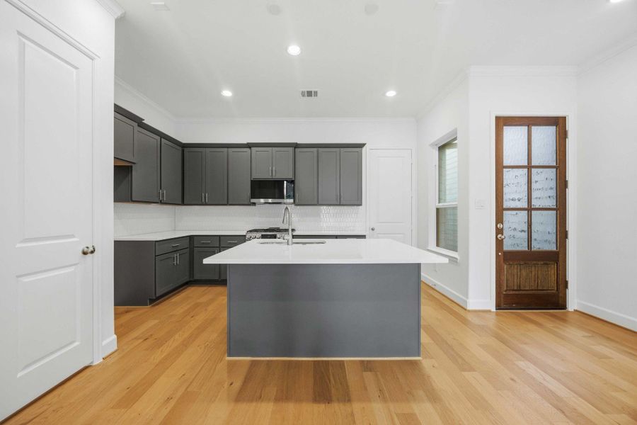 Step through the majestic 8-foot wood and glass front door into a home where every detail is designed to flow seamlessly.
