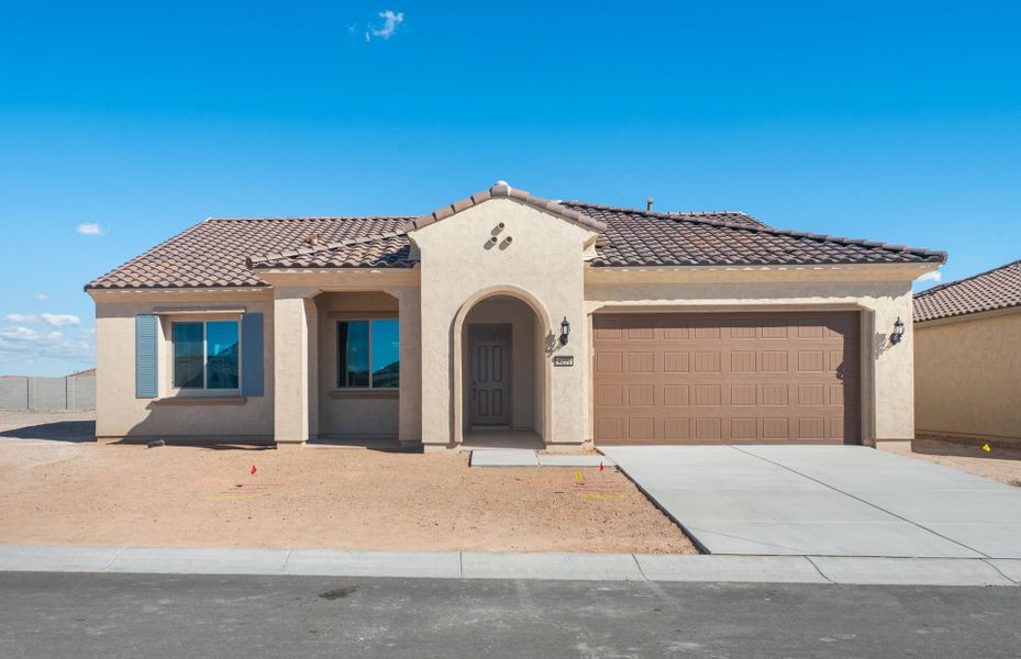 Front exterior of a new home in Sun City Anthem at Merrill Ranch, Florence, AZ, highlighting curb appeal (Image 1). Front exterior of a new home in Sun City Anthem at Merrill Ranch, Florence, AZ, highlighting curb appeal (Image 1).