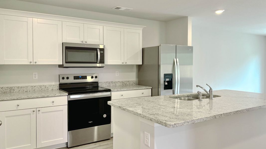 Representative furnished interior of a home built from the Roland by D.R. Horton in Huntington Estates, Millington (Image 3).