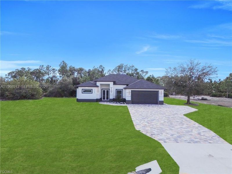 Front exterior of a new home in , Labelle, FL, highlighting curb appeal (Image 19).