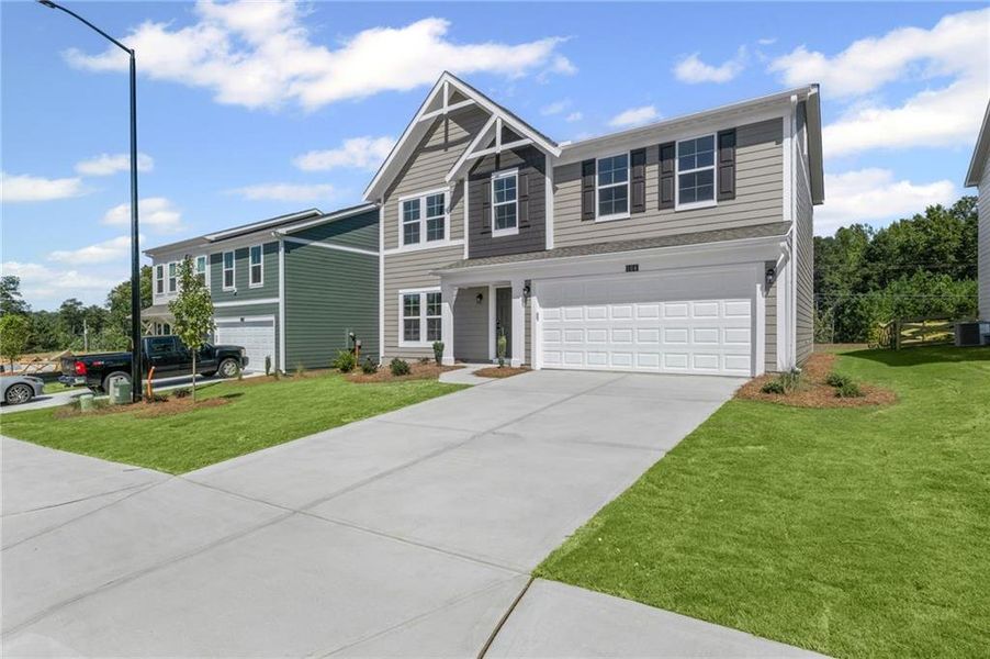 Front exterior of a new home in Sage Woods, Dallas, GA, highlighting curb appeal (Image 1). Front exterior of a new home in Sage Woods, Dallas, GA, highlighting curb appeal (Image 1).