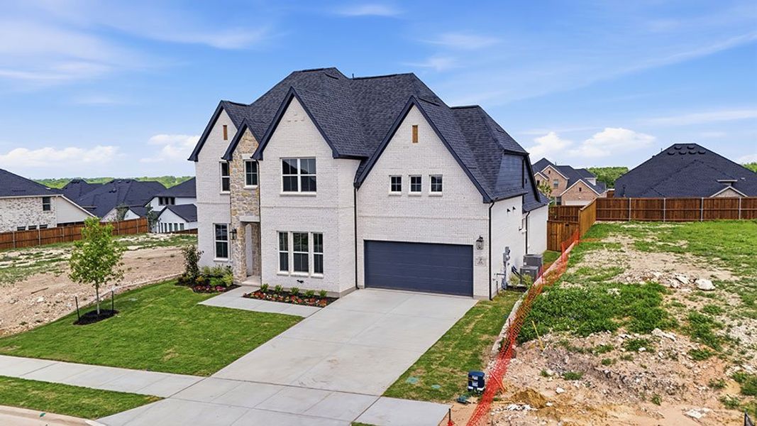 Front exterior of a new home in Hillside Village, Celina, TX, highlighting curb appeal (Image 21). Front exterior of a new home in Hillside Village, Celina, TX, highlighting curb appeal (Image 21).